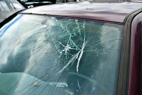 A broken and shattered windshield