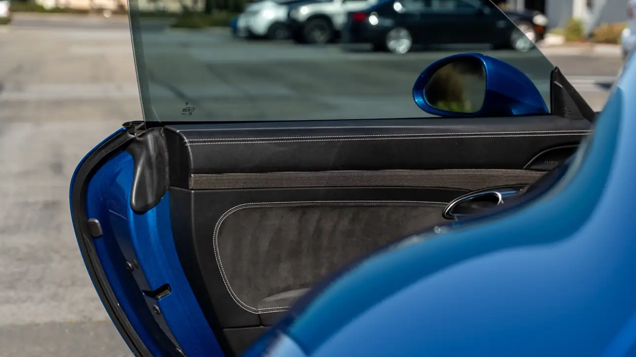 A brand new car door glass being placed and fixed in Omaha.