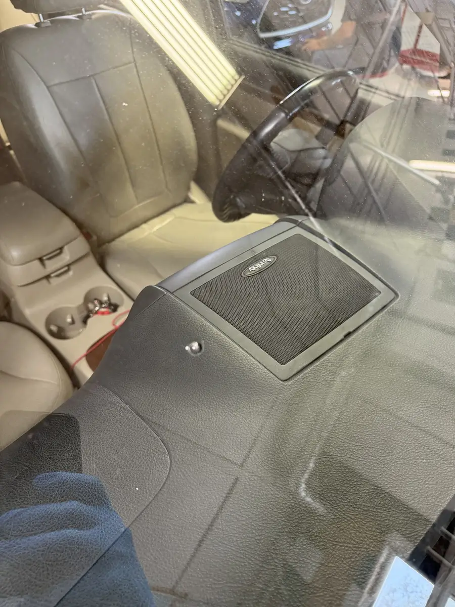 Revival Auto Glass diagnosing a rock chip repair in Omaha.